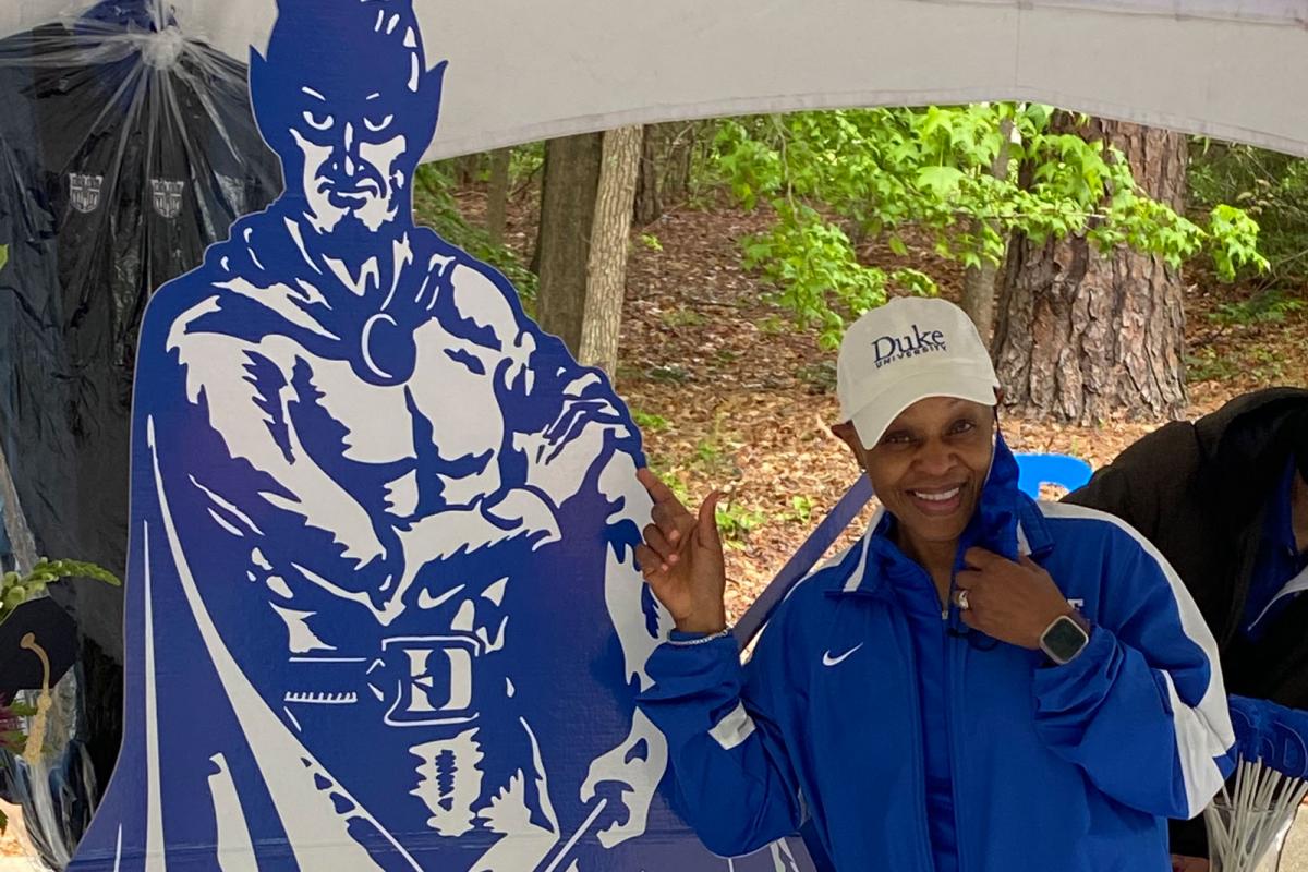 Jacqueline Looney poses with cardboard cutout of the Duke Blue Devil mascot