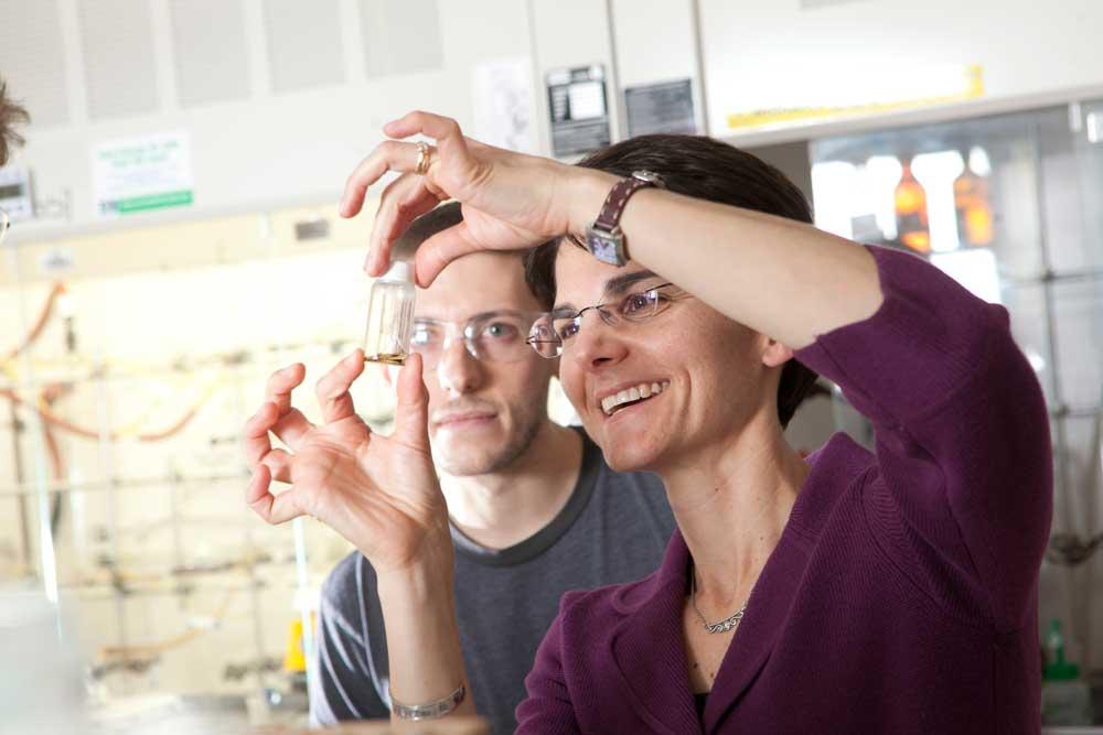Katherine J. Franz and another person in a lab.