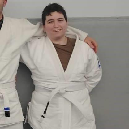 Courtney Johnson smiling in Jiu-Jitsu uniform