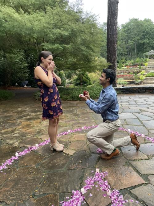 Bijan Abar proposing to Rebecca Gibson in the Duke Gardens.