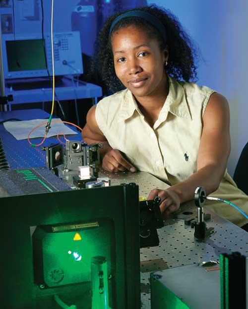 Audrey Ellerbee posing in a lab with technology.