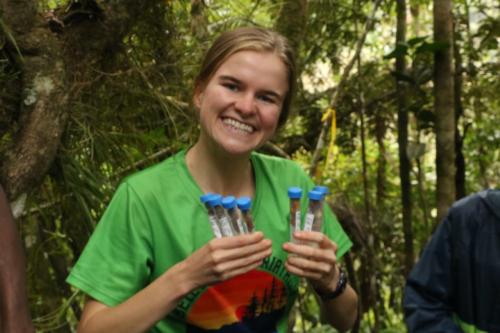 Camille DeSisto holds vials during her research trip to Madagascar in summer 2022.