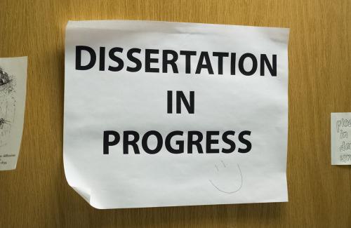 Sign on door that says "Dissertation in Progress"