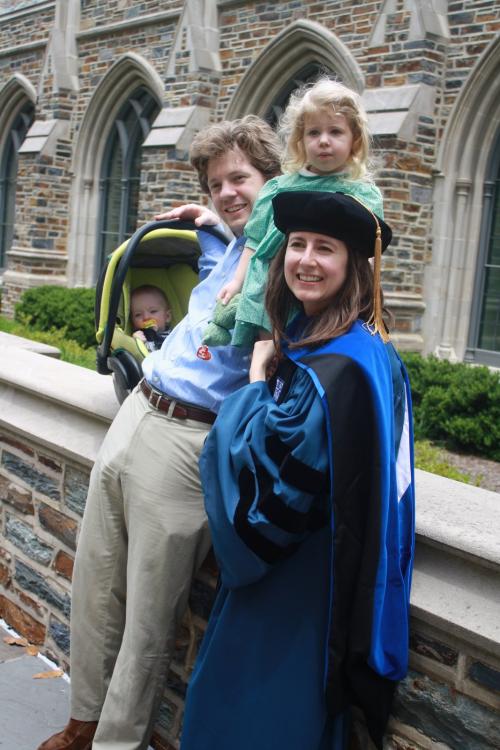 Nichole Theresa Gleisner, PhD, with her husband Tadhg, daughter Josephine, and son Conall at her graduation from Duke in 2011.