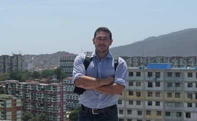 Alejandro Velasco poses with the city of Caracas, Venezuela in the background.